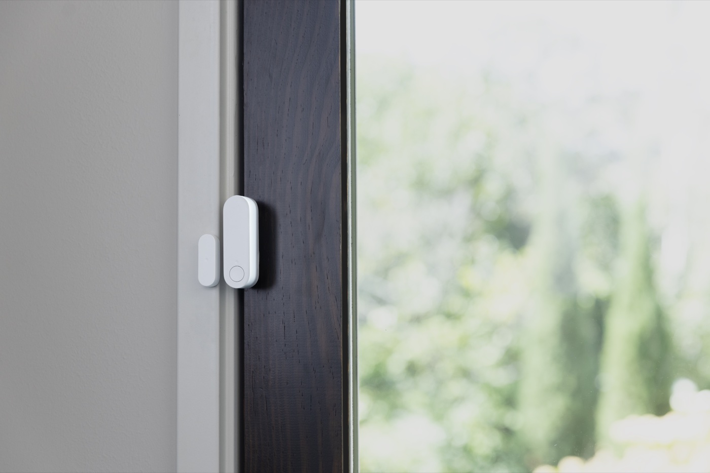 An ADT door and window sensor mounted on a home's door frame, the kind of detail we check during your assessment